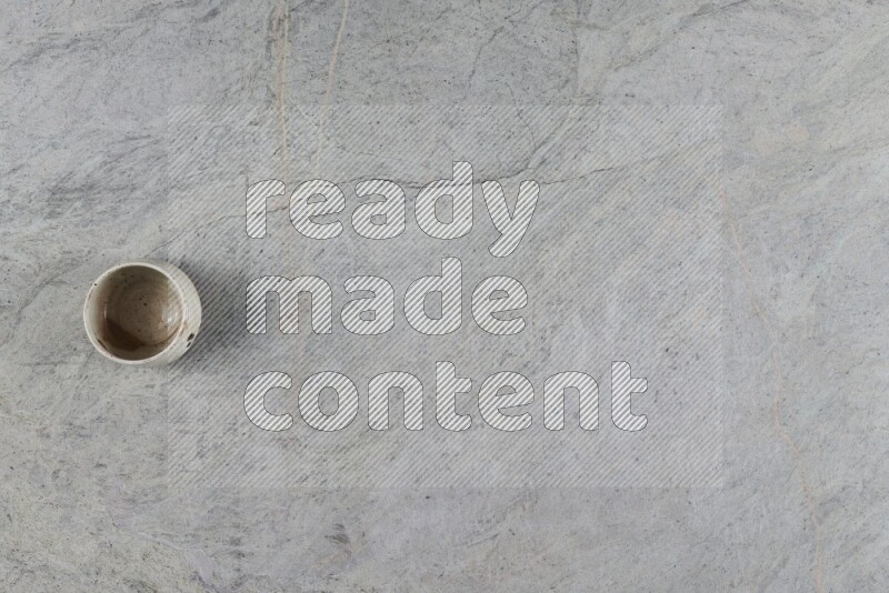 A multicolored pottery Bowl on grey marble background