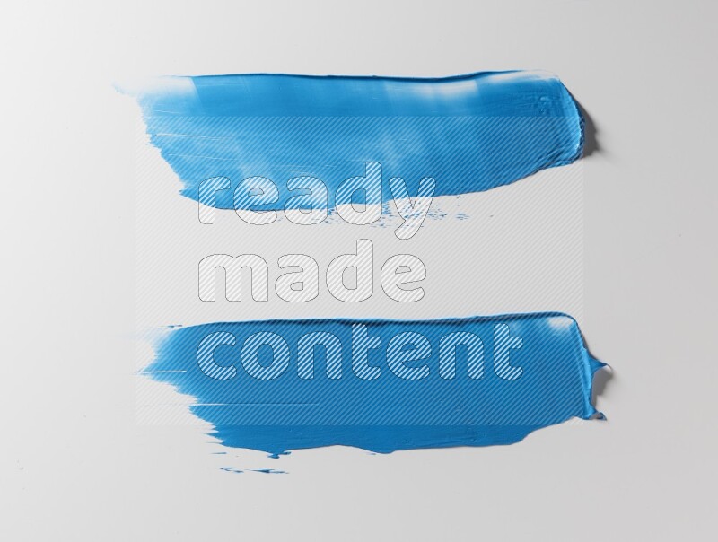 Blue painting knife strokes on white background