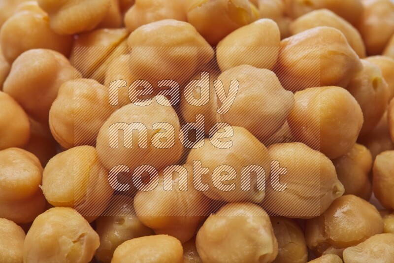 Close up shot of boiled chickpeas on white background