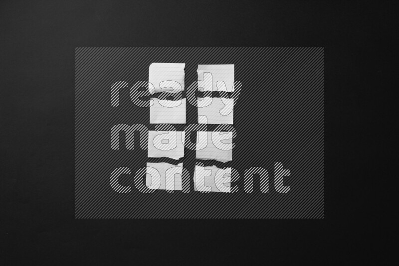 Ripped notebook sheet on black background