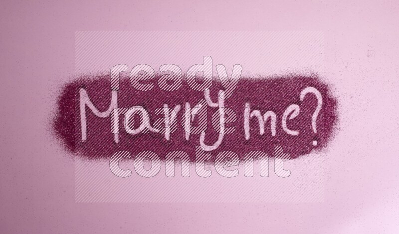 A sentence written with pink glitter on pink background