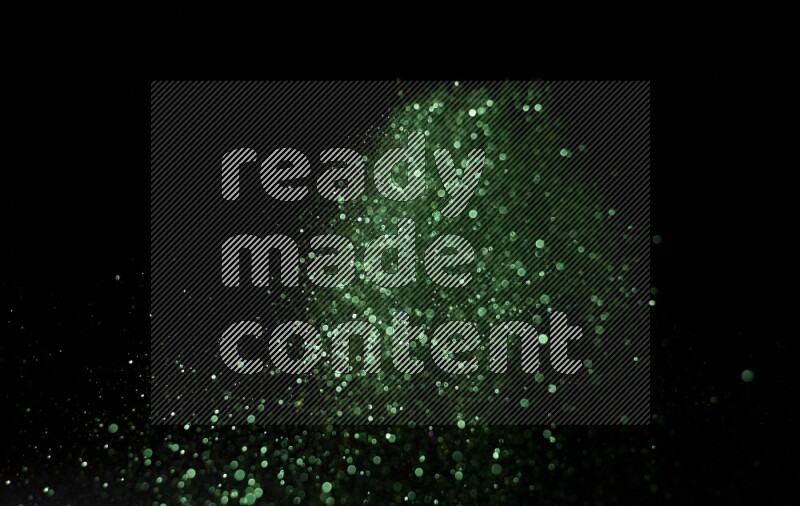Green glitter powder isolated on black background