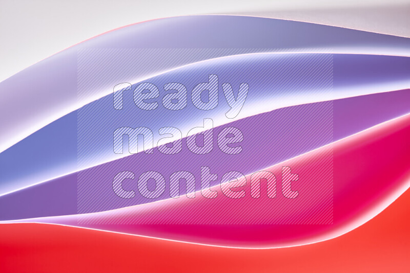 This image showcases an abstract paper art composition with paper curves in white and different warm gradients created by colored light