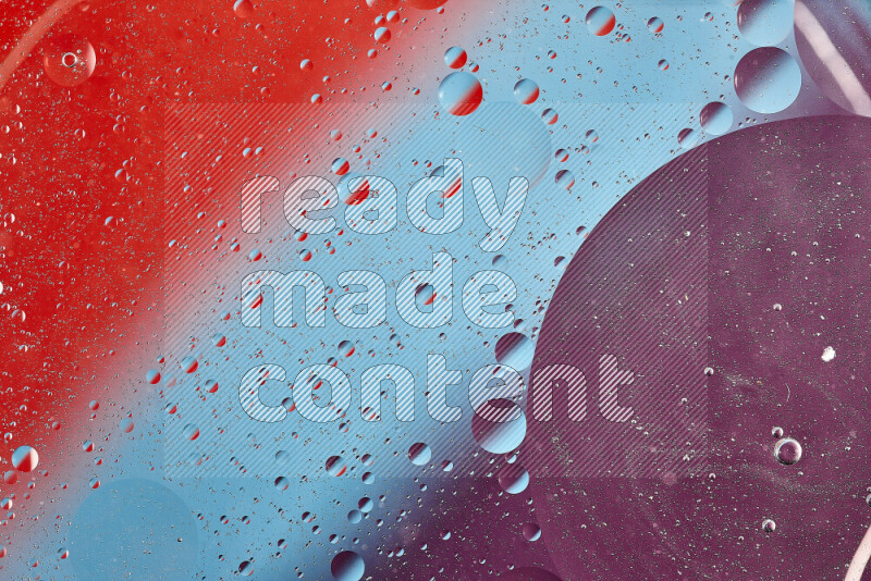 Close-ups of abstract oil bubbles on water surface in shades of blue, red and purple