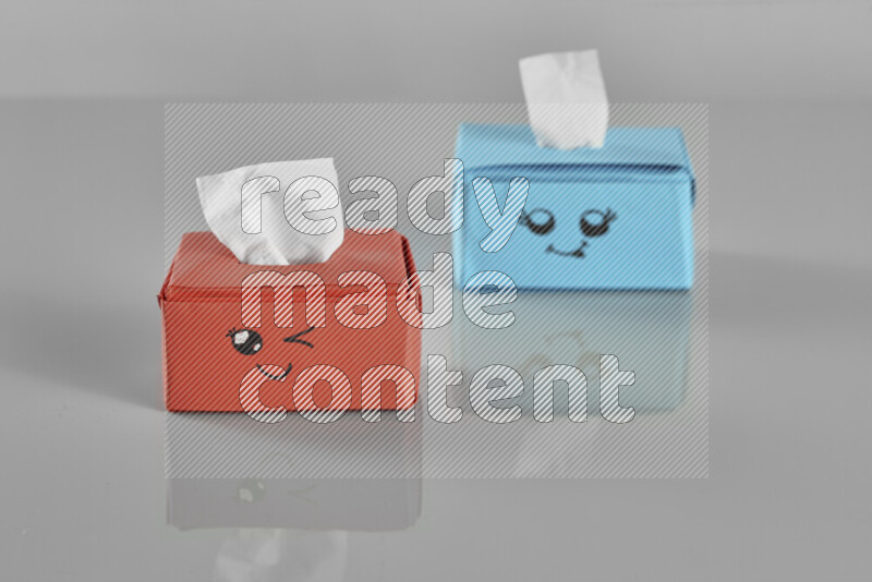 Origami tissue box on grey background