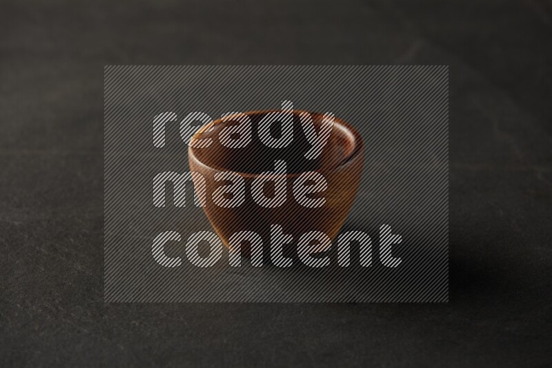 multi color round sauce bowl on grey textured countertop