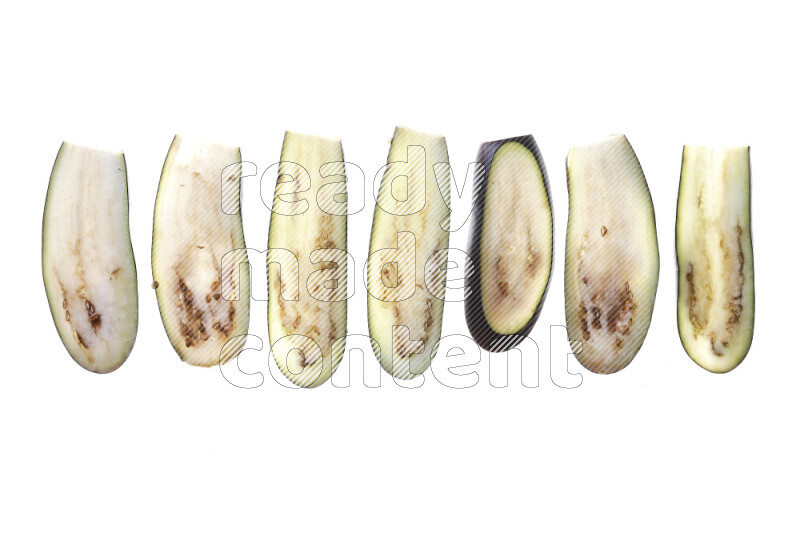 Eggplant slices on illuminated white background