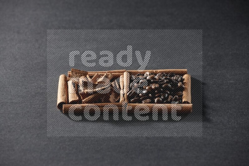2 squares of cinnamon sticks full of coffee beans and cinnamon on black flooring