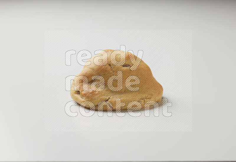 a chocolate chip cookie on a white background