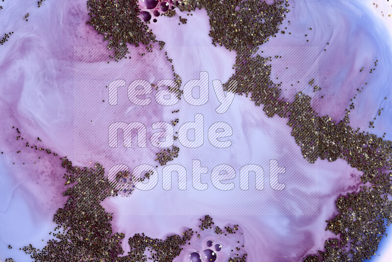 لقطة مقربة لبريق ذهبي متلألئ منتشر على خلفية من اللون الأزرق والأحمر في حركات دائرية