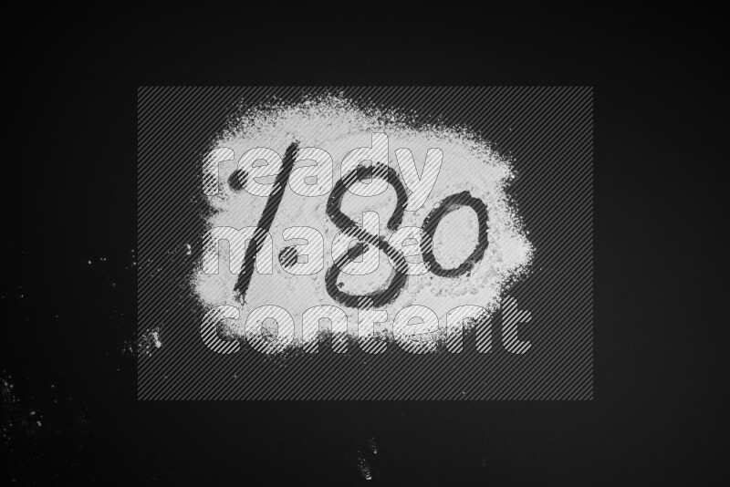 Percentages written with powder on black background