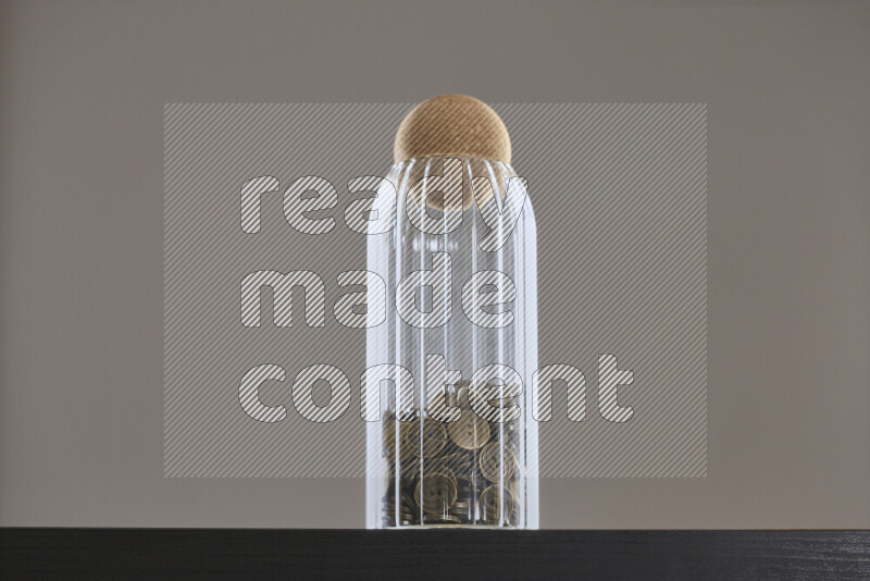 Buttons in a glass jar on black background
