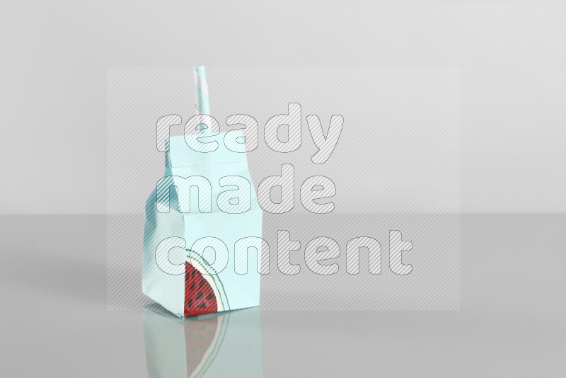 Origami juice box on grey background
