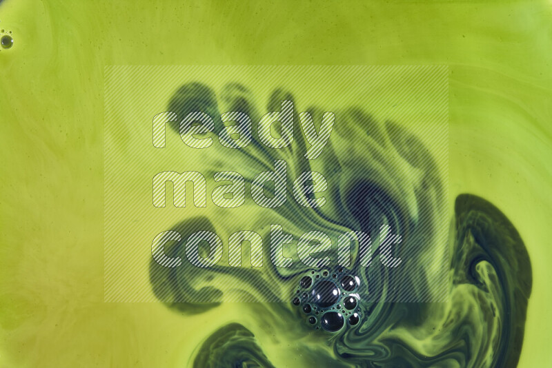 A close-up of abstract swirling patterns in green gradients