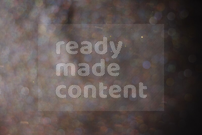 Multicolored glitter powder isolated on black background