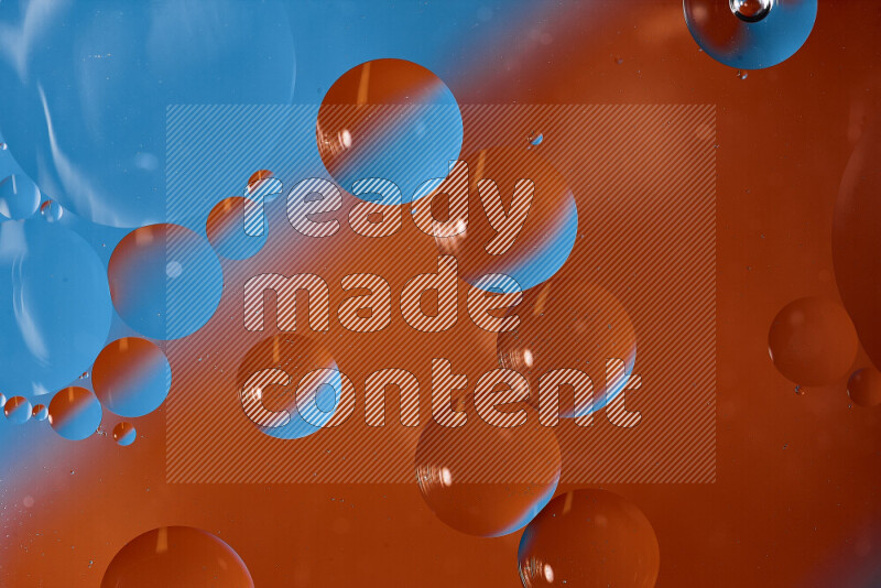 Close-ups of abstract oil bubbles on water surface in shades of blue and orange