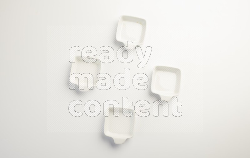 white ceramic square sauce dish on white countertop