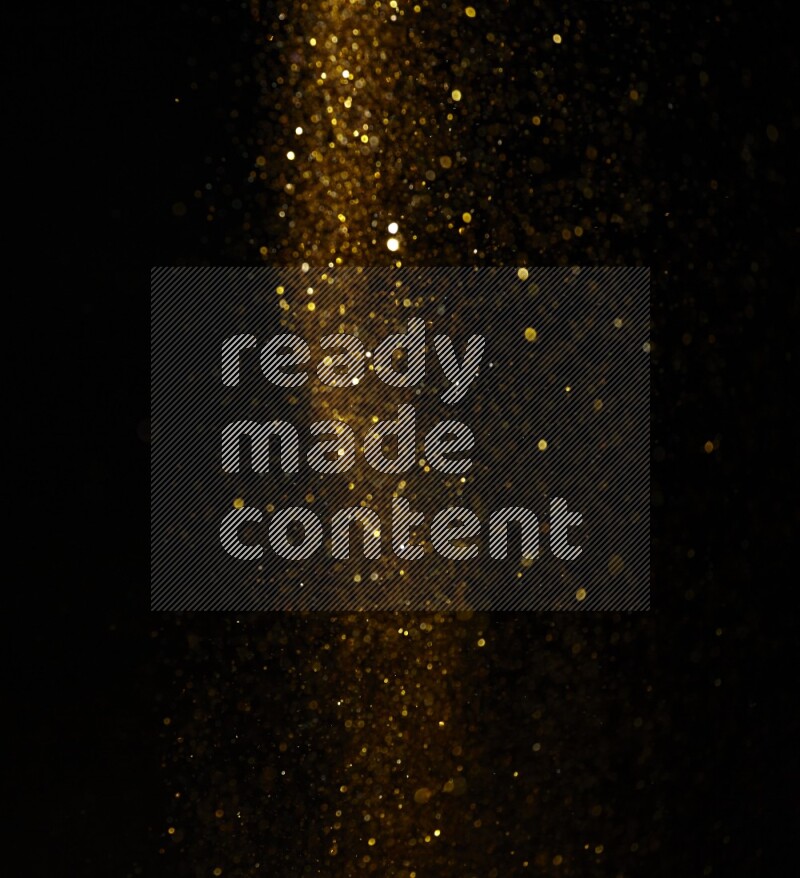 Gold glitter powder isolated on black background