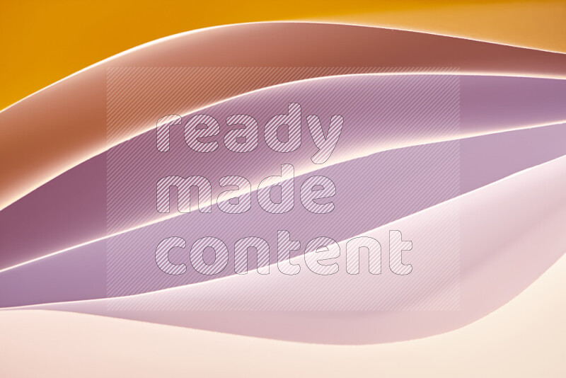 This image showcases an abstract paper art composition with paper curves in white and different warm gradients created by colored light