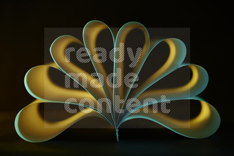 An abstract art piece displaying smooth curves in yellow and green gradients created by colored light
