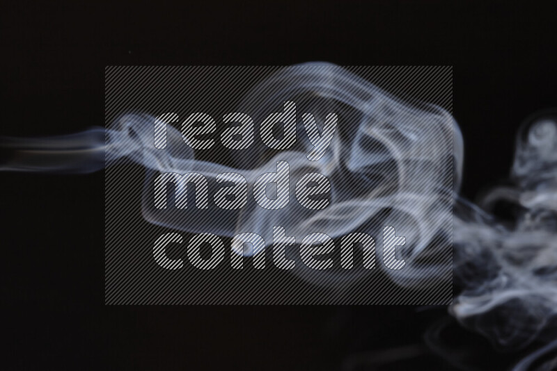 Motion of wavy smoke isolated on dark background