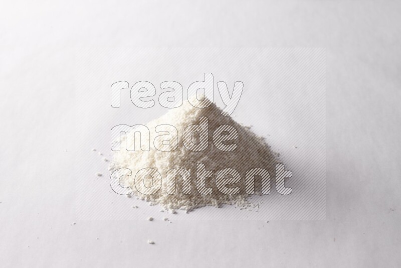 Desiccated coconuts on white background