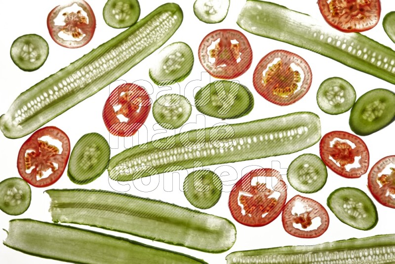 Mixed vegetables slices on illuminated white background