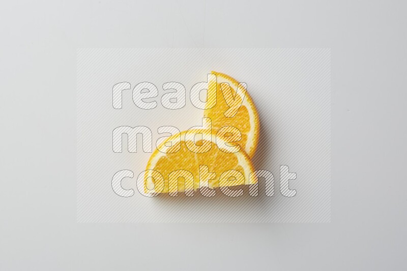 Two halves of an orange slices on white background
