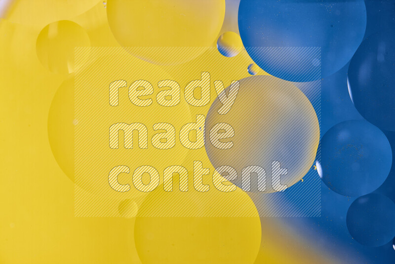 Close-ups of abstract oil bubbles on water surface in shades of blue and yellow