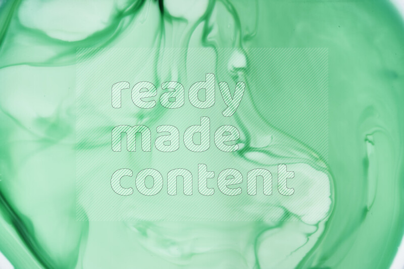 A close-up of abstract swirling patterns in green gradients