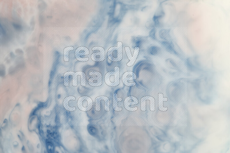 A close-up of abstract swirling patterns in blue, red and white