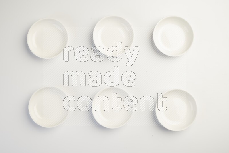 white ceramic round sauce dish on white countertop