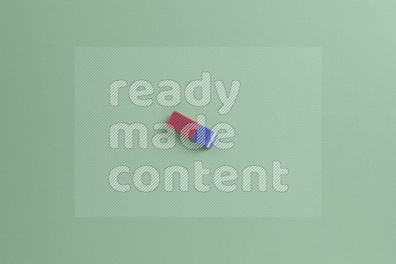 Different school supplies on green background