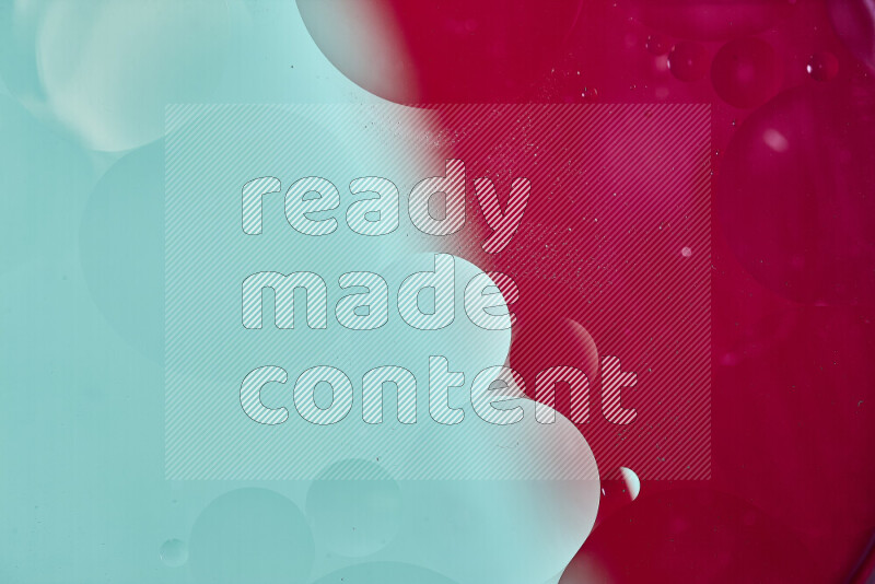 Close-ups of abstract oil bubbles on water surface in shades of green and red