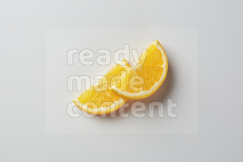 Two halves of an orange slices on white background