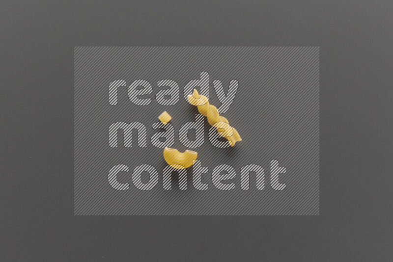 Different pasta types on grey background