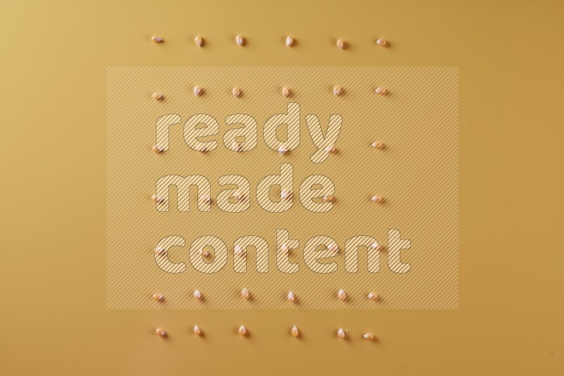 Popcorn seeds on a yellow background in different angles