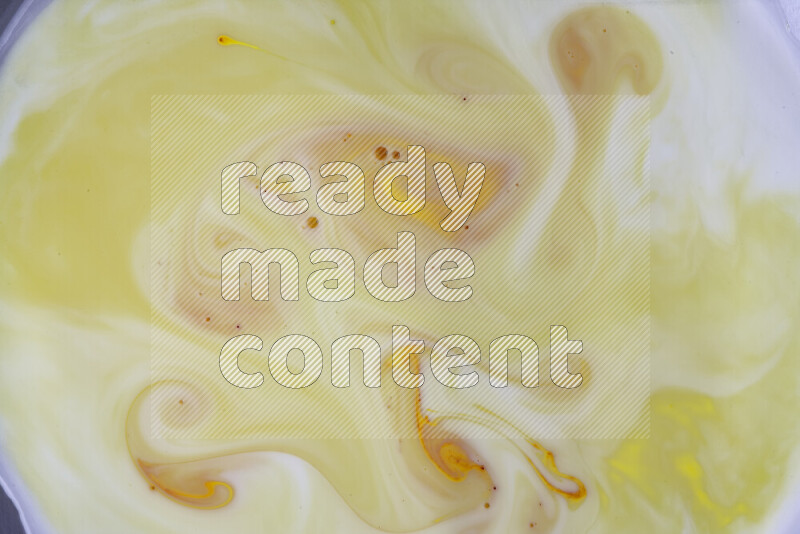 A close-up of abstract different swirling patterns in orange