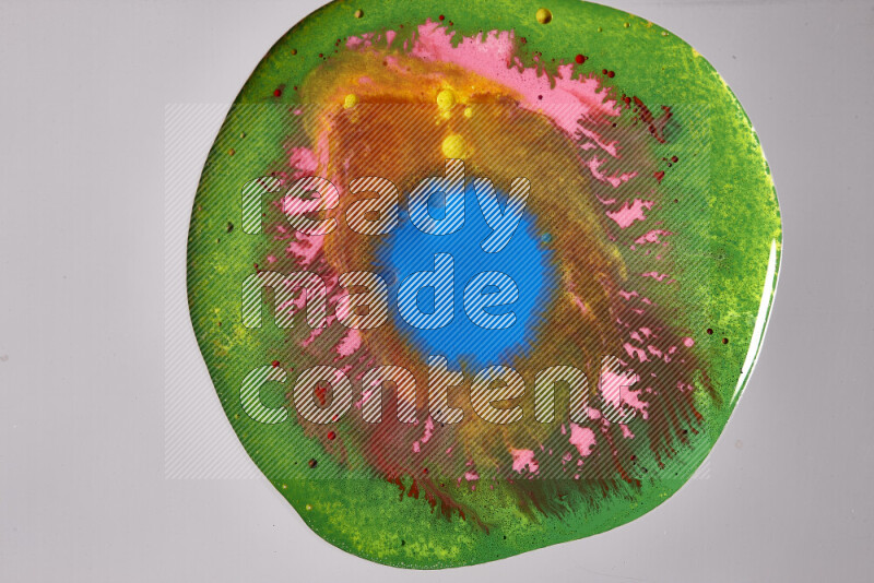 Close-ups of assorted colors blending on a grey background