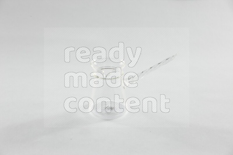 Glassware such as coffee pot, cup, saucer and jar on white background