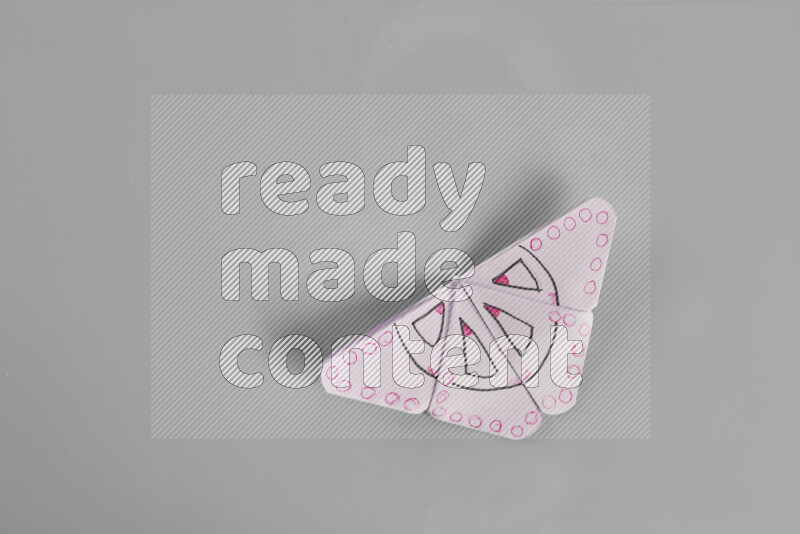 Origami butterfly on grey background