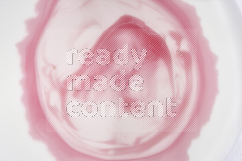 A close-up of abstract swirling patterns in red and white