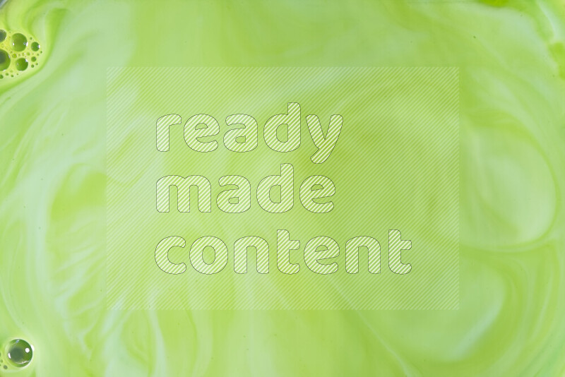 A close-up of abstract swirling patterns in green gradients