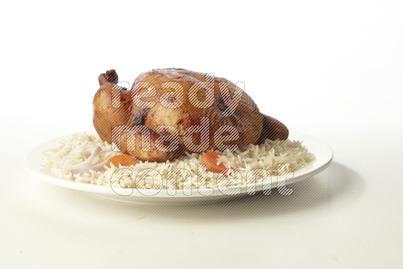 white  basmati Rice with  whole roasted chicken  on a white rounded plate direct on white background
