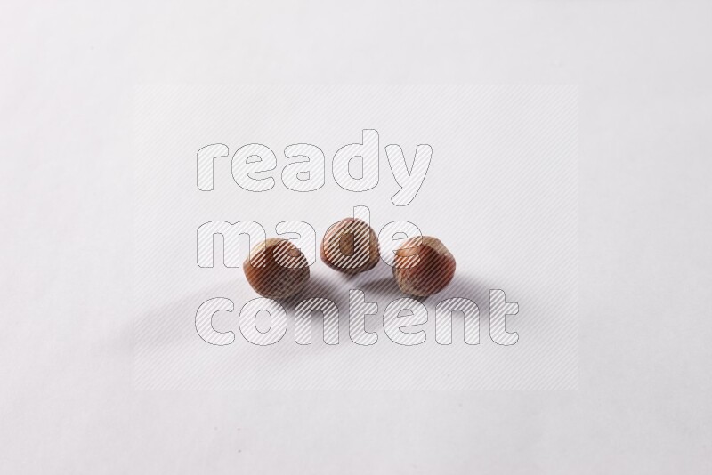 Hazelnuts on white background