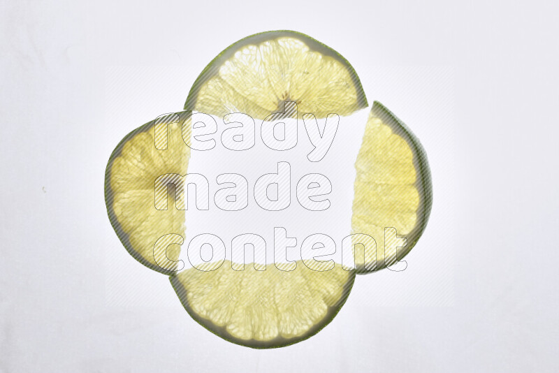 Orange slices on illuminated white background