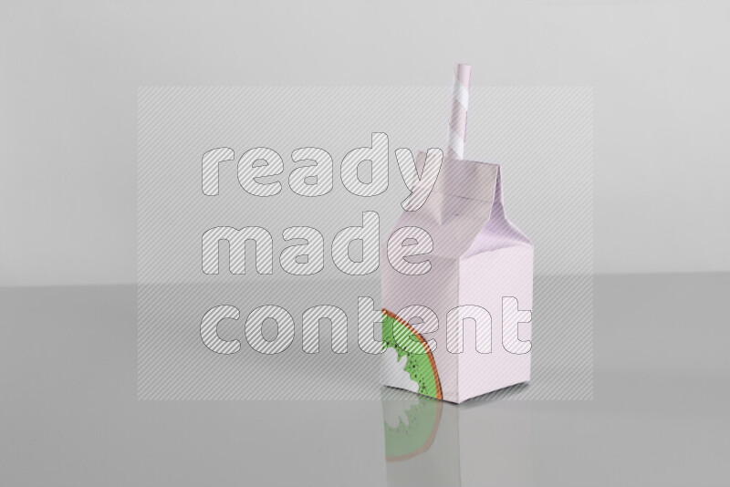 Origami juice box on grey background