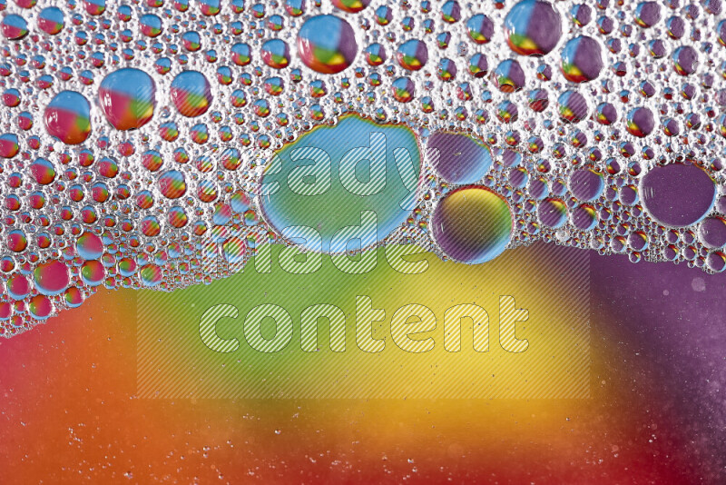 Close-ups of abstract soap bubbles and water droplets on multicolored background