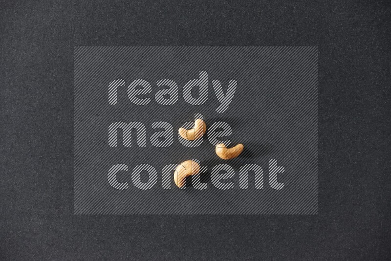 3 cashews on a black background in different angles