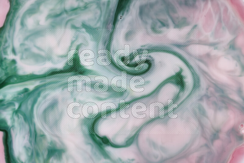 A close-up of abstract swirling patterns in red and green
